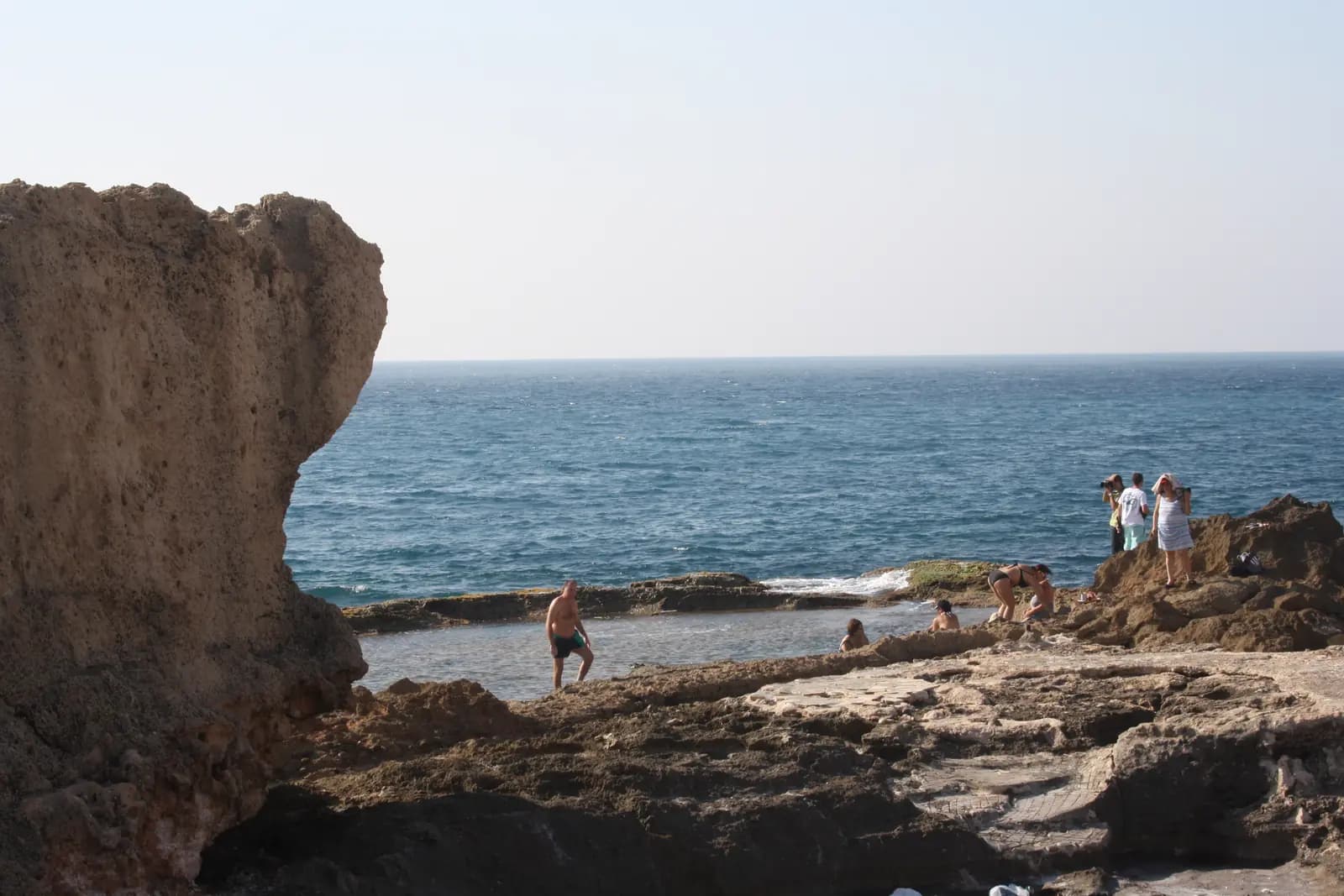 People swimming from Batroun's rocky coast